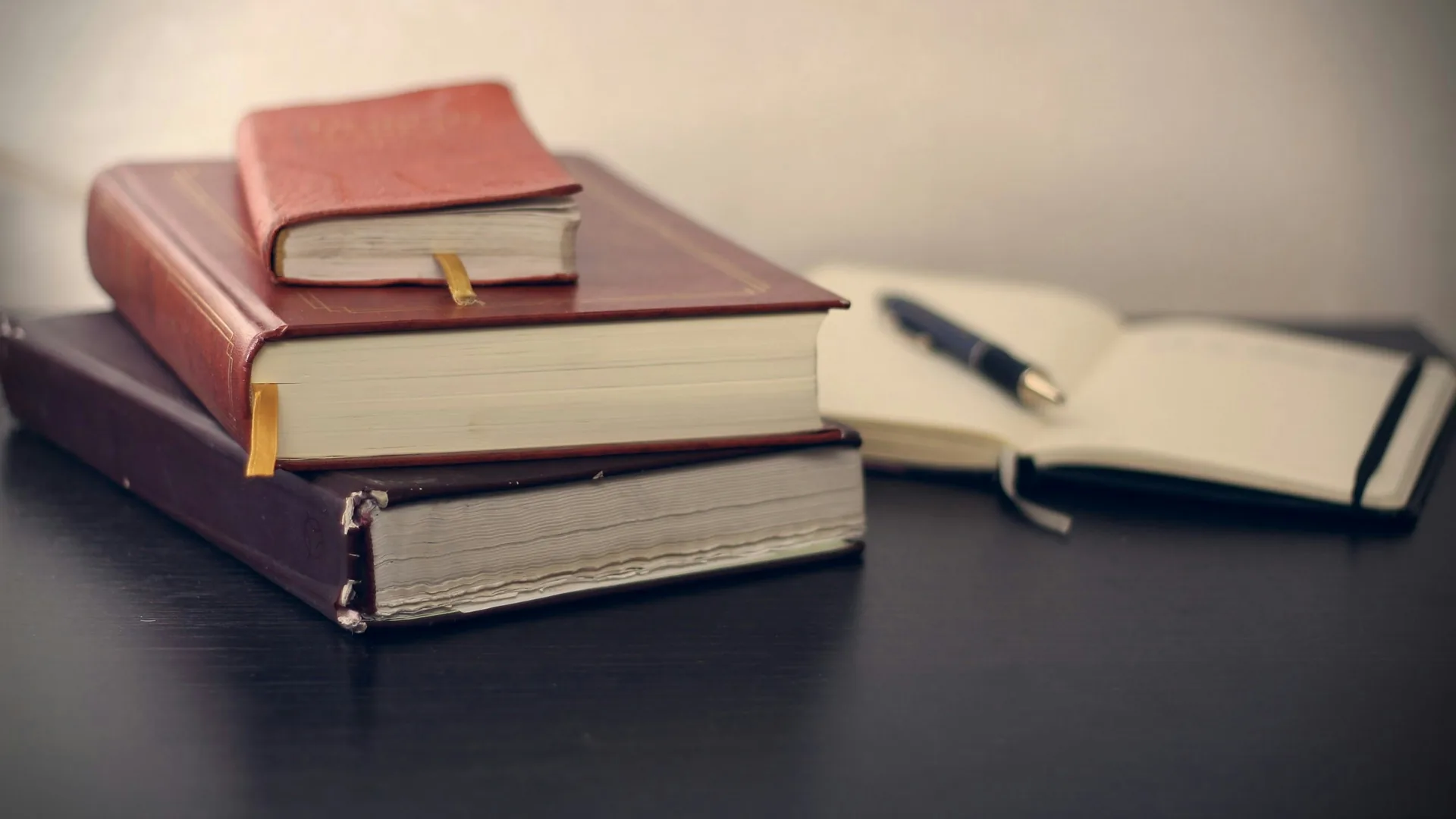 Legal books and open notebook on a professional desk